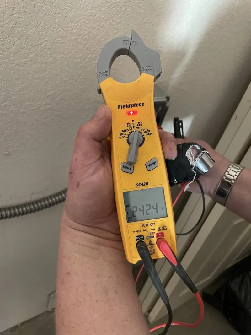 Voltage testing with clamp meter during Outlet Installation in Athens
